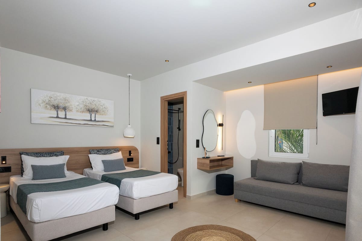 Triple Room, Garden View | Desk, iron/ironing board (on request), cribs (free), WiFi (free)