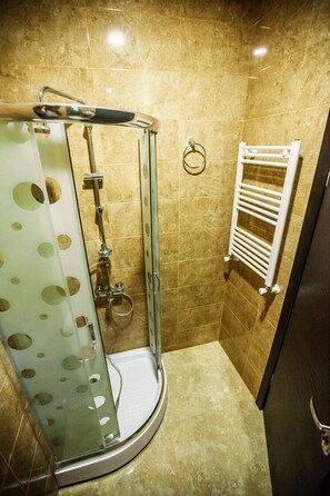 Shower, free toiletries, hair dryer, slippers