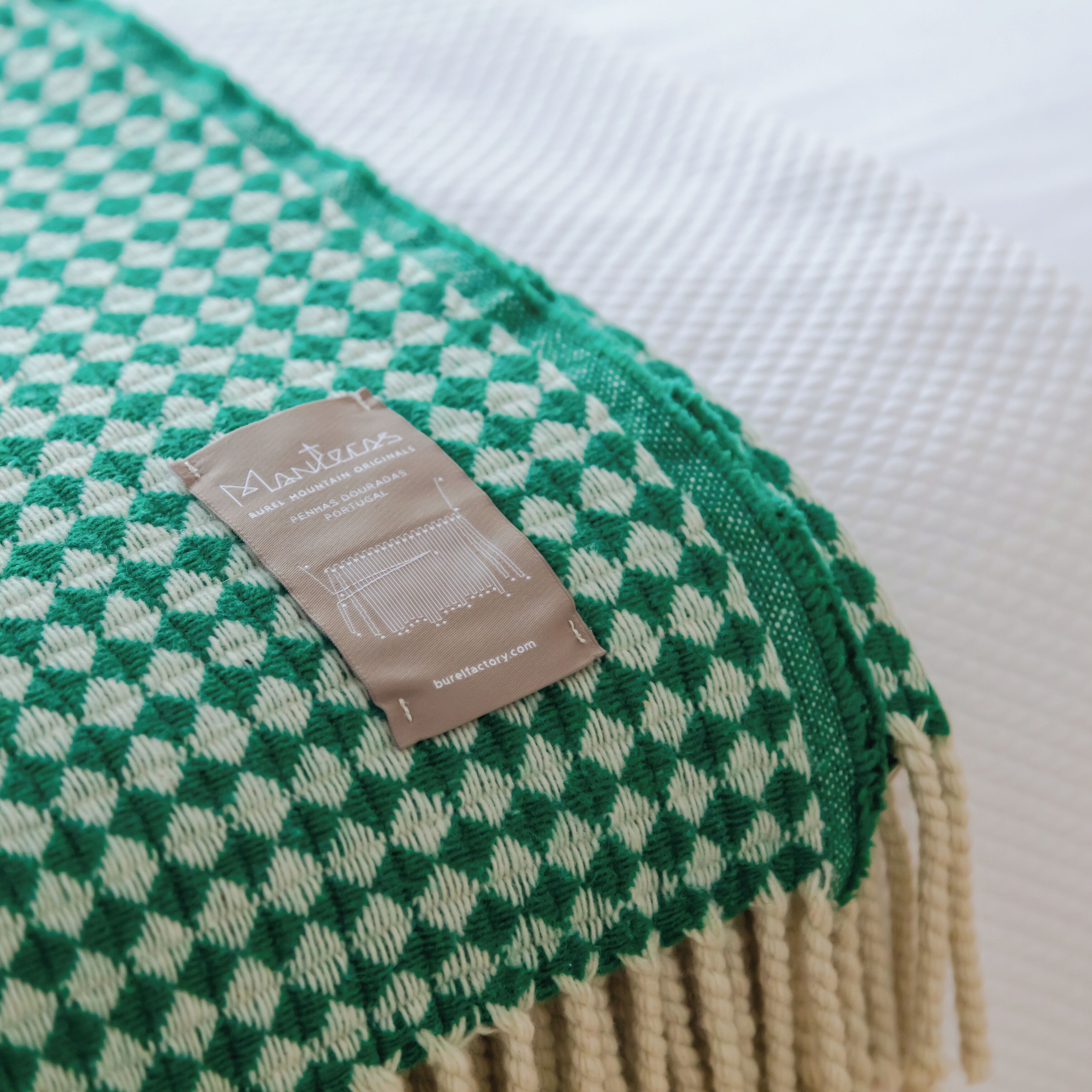 A checkered blanket with a label on it.