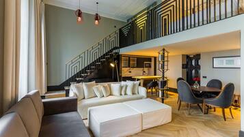 Loft Suite | Living area | Flat-screen TV, heated floors