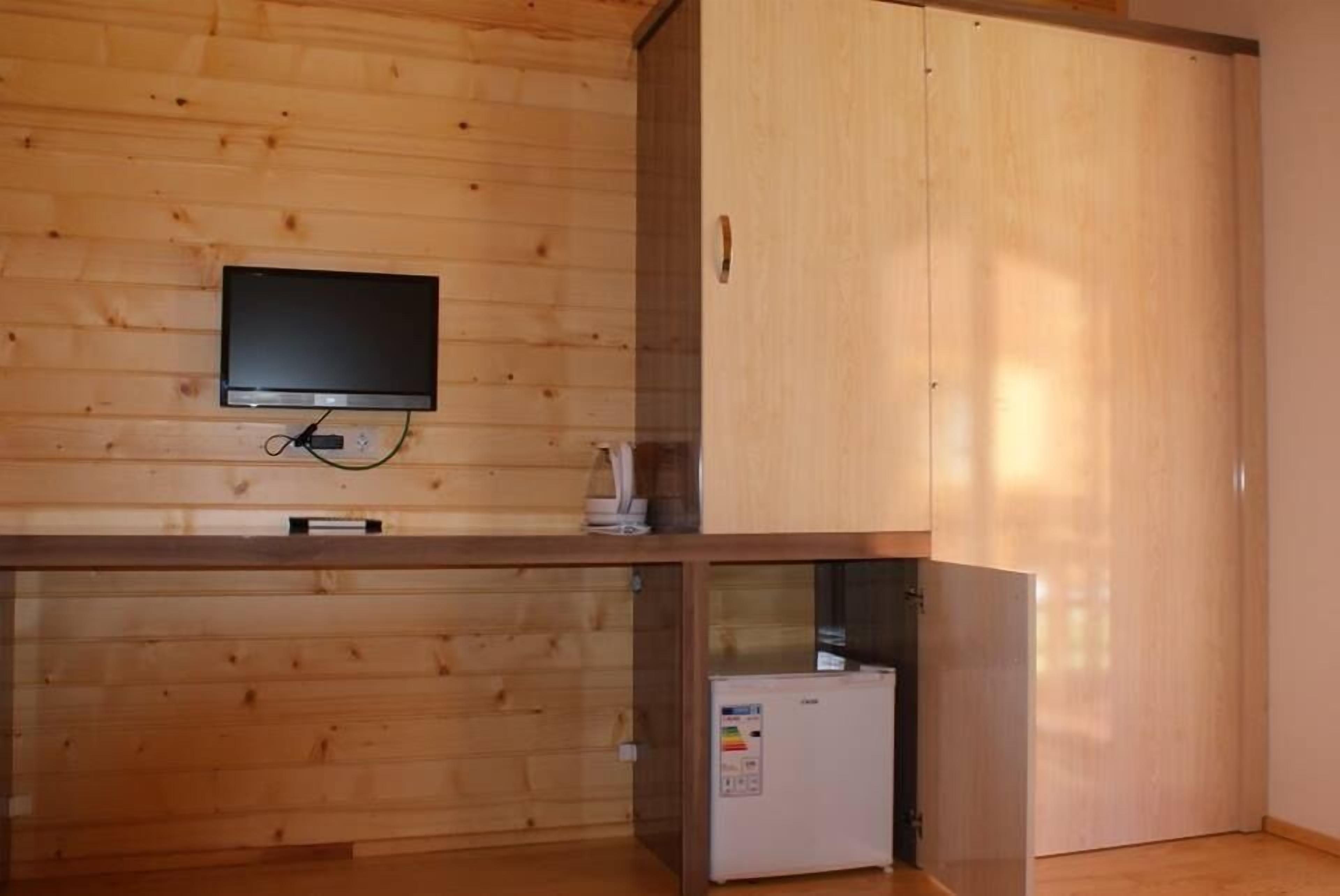 deluxe triple room | living room | lcd tv