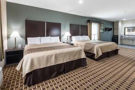 Premium bedding, memory-foam beds, desk, blackout curtains. Scottish Inns & Suites