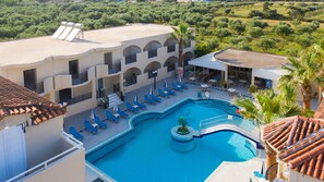 A rooftop pool area with blue lounge chairs, a central pool, and a bar area. - Hera Zakynthos Hotel (Zakynthos)