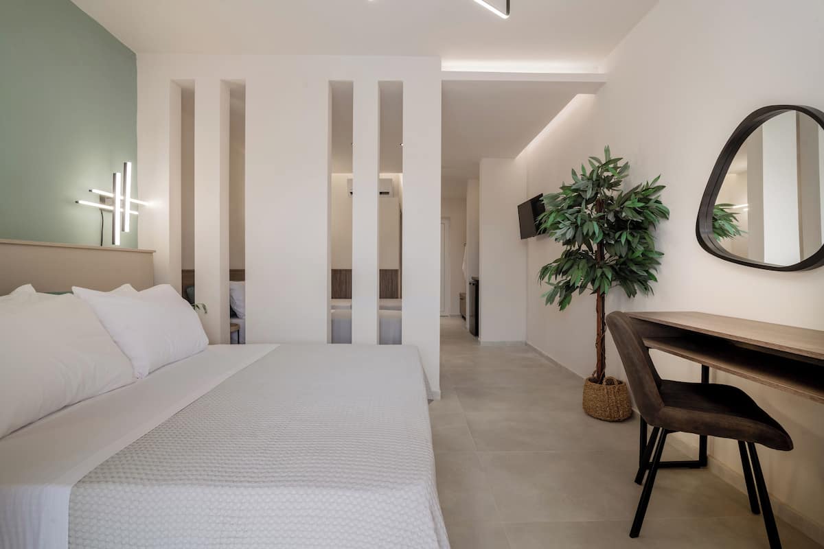 deluxe room, pool view | 1 bedroom, in-room safe, desk, free wifi