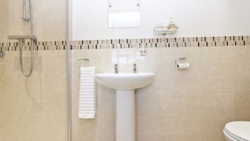 Shower, free toiletries, slippers, towels