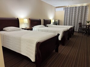 Triple Room | Blackout drapes, iron/ironing board, free WiFi, bed sheets