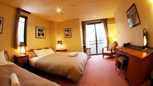 A hotel room with two beds, a desk, a chair, and a large window. - Morino Lodge Hakuba (Hakuba)