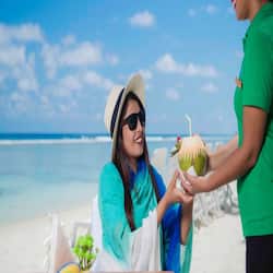 On the beach, white sand, sun-loungers, beach umbrellas