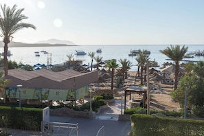 Private beach, white sand, sun loungers, beach umbrellas