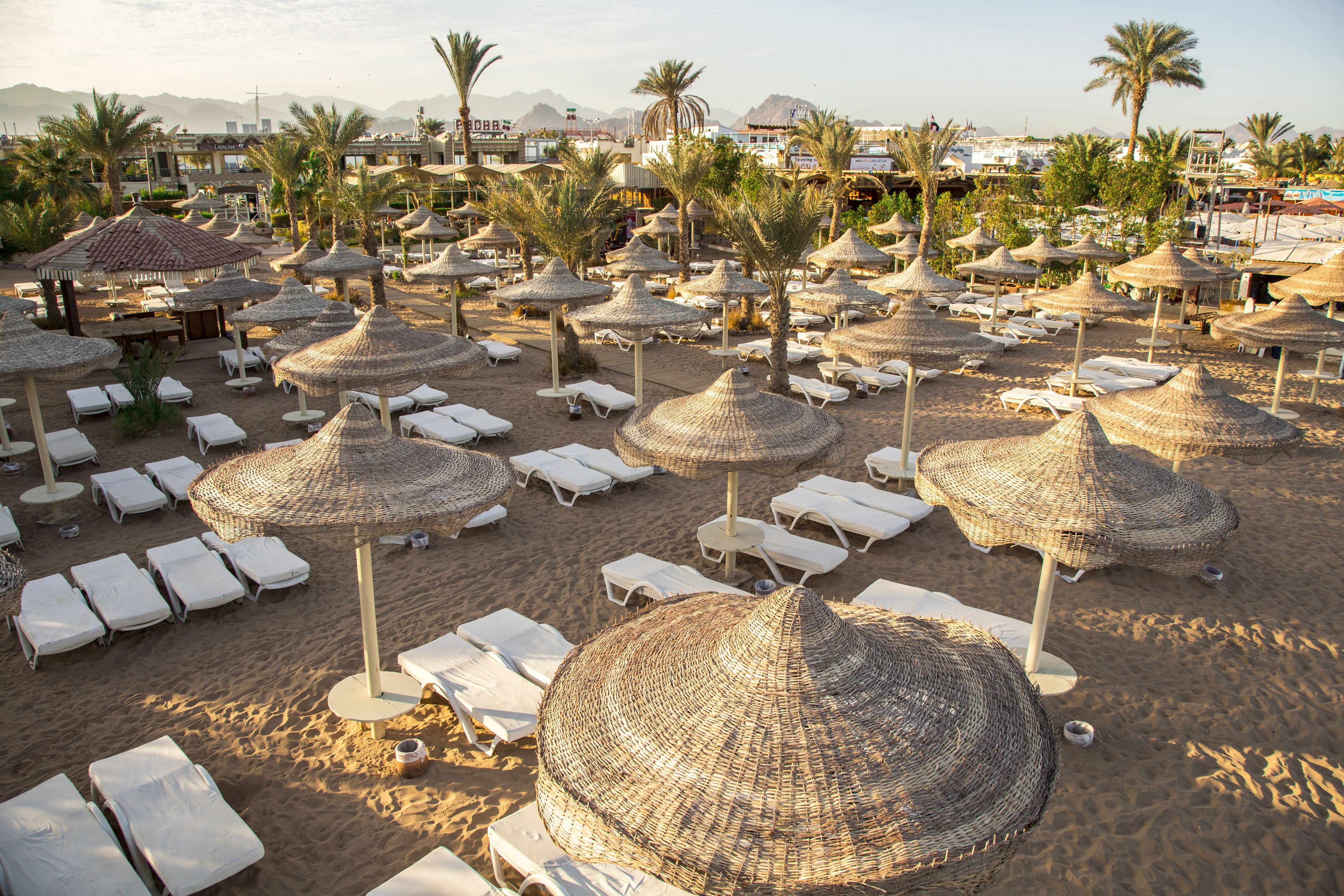 Private beach, white sand, sun loungers, beach umbrellas