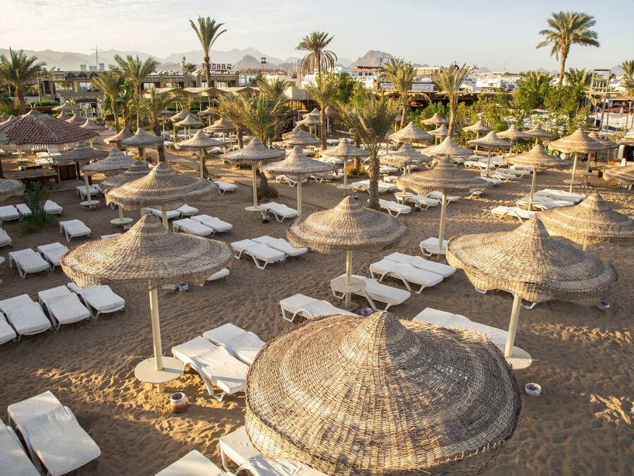 Private beach, white sand, sun loungers, beach umbrellas