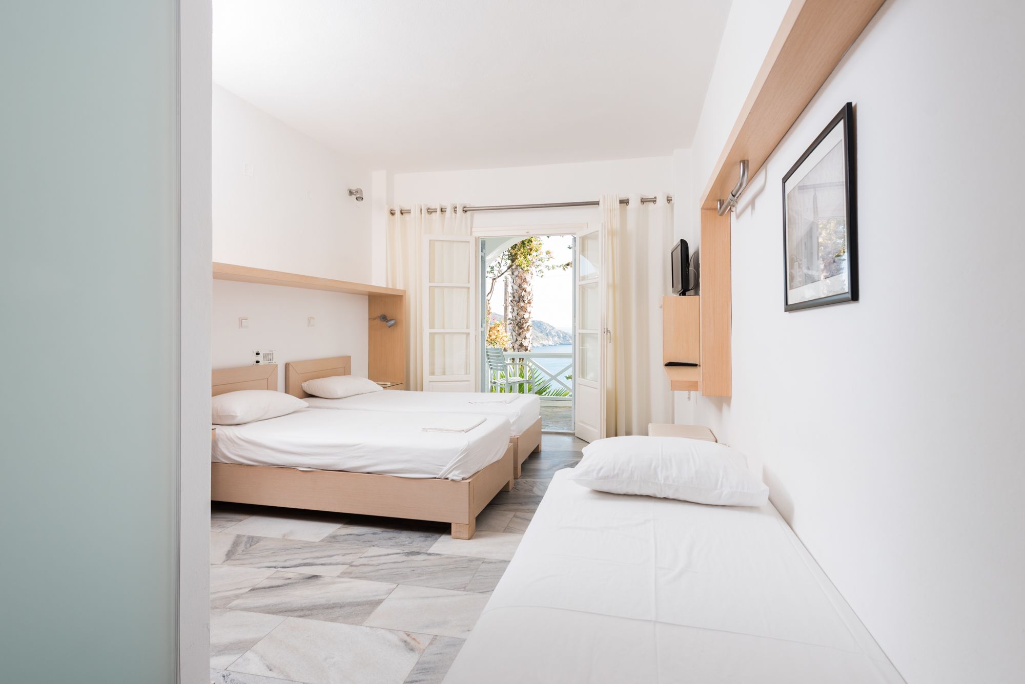 standard triple room, sea view | hypo-allergenic bedding, in-room safe, iron/ironing board, free wifi