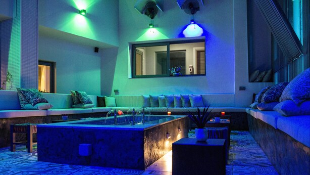A modern lounge area with a pool table, seating, and ambient lighting. - Urbano Hotel (Accra)