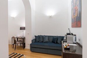 Superior Triple Room, City View | Living area | Flat-screen TV