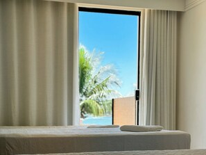 Deluxe Quadruple Room, Canal View | Minibar, laptop workspace, blackout drapes, iron/ironing board - Hotel Premium Recanto da Passagem (Cabo Frio)