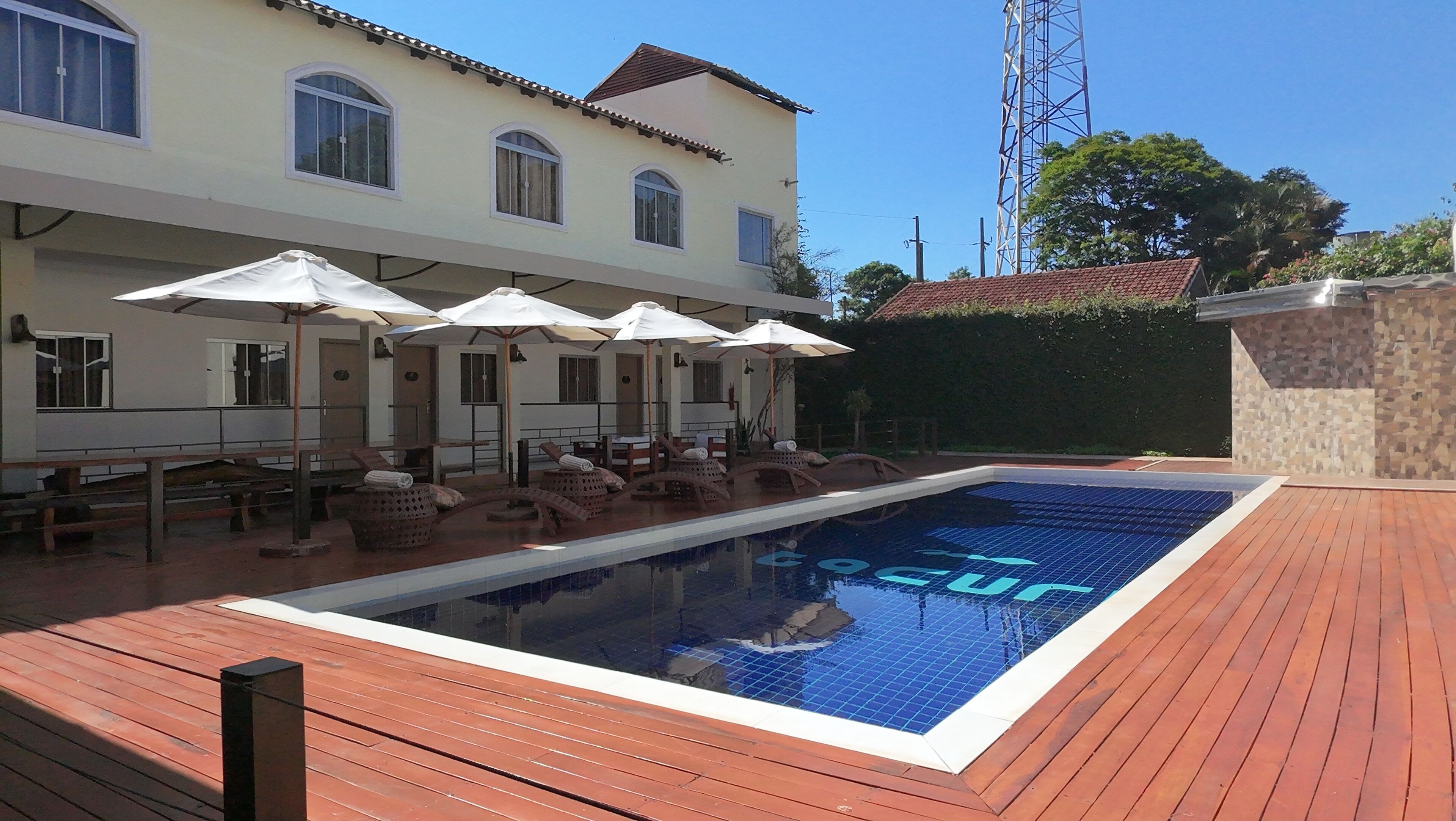 outdoor pool, pool umbrellas, pool loungers