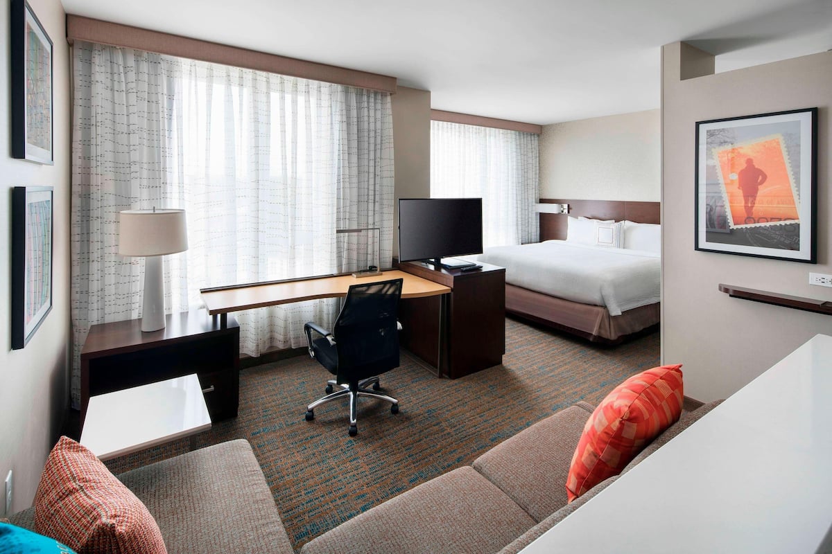 studio suite, 1 king bed with sofa bed, non smoking | living area | 32-inch smart tv with premium tv channels, tv, netflix