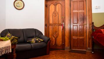 Standard Double Room | Living area | Flat-screen TV