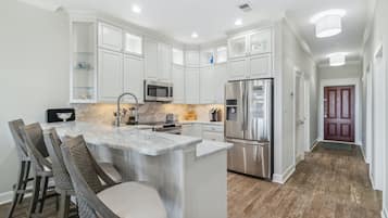 Condo, 3 Bedrooms (E302) | Private kitchen | Microwave, coffee/tea maker, toaster, cookware/dishes/utensils