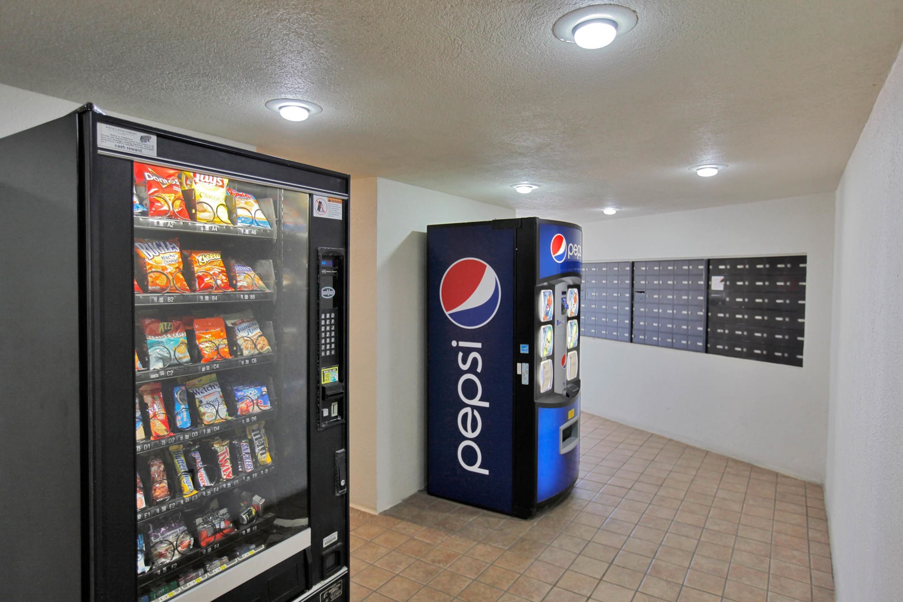 A vending machine area with a Pepsi machine and a snack vending machine.