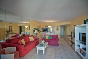 Condo, 2 Bedrooms, Sea View (404) | Living area | 40-inch flat-screen TV with cable channels, TV, DVD player