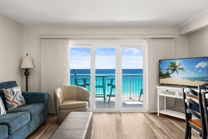 Condo, Ocean View, Beachfront | Living area | 52-inch flat-screen TV with digital channels, TV