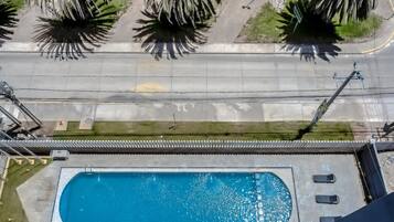 Seasonal outdoor pool, pool loungers