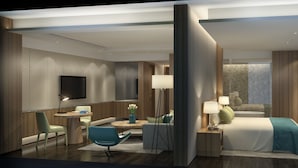 A modern hotel room with a bed, bedside tables, a TV, and a seating area with a chair and a table. - Shanghai Pudong Theme Park Wassim Hotel (Shanghai)