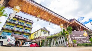 A traditional Thai building with a wooden roof and a signboard. - Baan Krittika (Udon Thani)