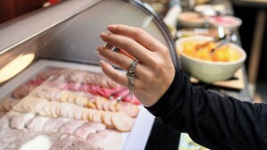A buffet with various food items including sliced meats, cheeses, and pastries. - Rudolfo  Hotel (Lviv)