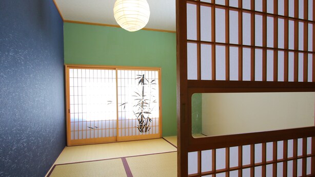 A traditional Japanese room with tatami flooring, a shoji screen door, and a hanging paper lantern. - Yoshimura (Fujikawaguchiko)