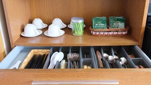A neatly organized kitchen drawer with utensils, plates, and glassware. - Yoshimura (Fujikawaguchiko)
