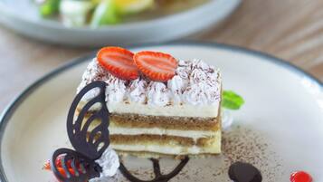 A dessert with strawberries and chocolate on a plate.