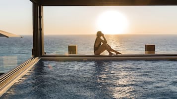 Indoor pool, outdoor pool, pool umbrellas, pool loungers