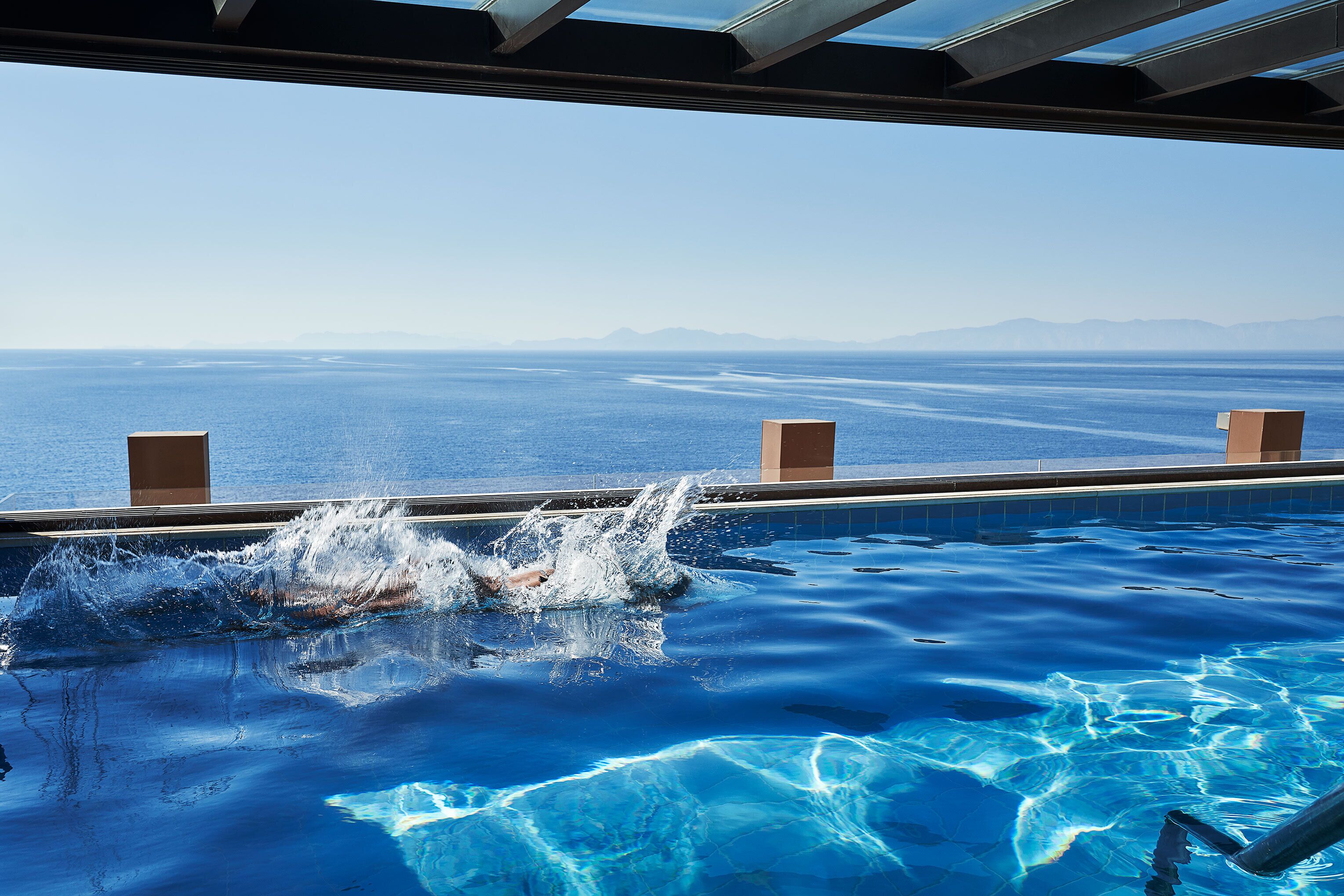 indoor pool, outdoor pool, pool umbrellas, pool loungers