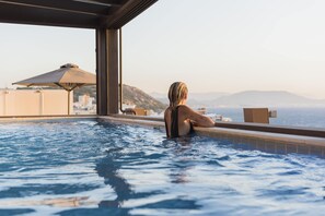 Indoor pool, outdoor pool, pool umbrellas, sun loungers - Bellevue On The Beach Suites (Rhodes)