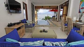 Villa, 1 Bedroom, Ocean View | Living area | Flat-screen TV, DVD player