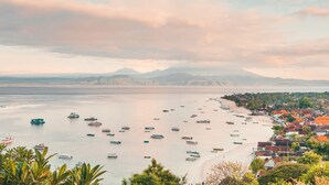A coastal town with boats on the water and houses along the shore. - Lembongan Sanctuary Villas (Lembongan Island)