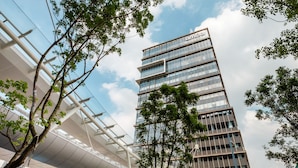 A modern building with a glass facade and a flat roof structure. - amba Taipei SongShan (Taipei)