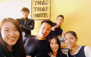 Experience the vibrant atmosphere of a Thai hostel, offering shared accommodations and a simple, functional space.