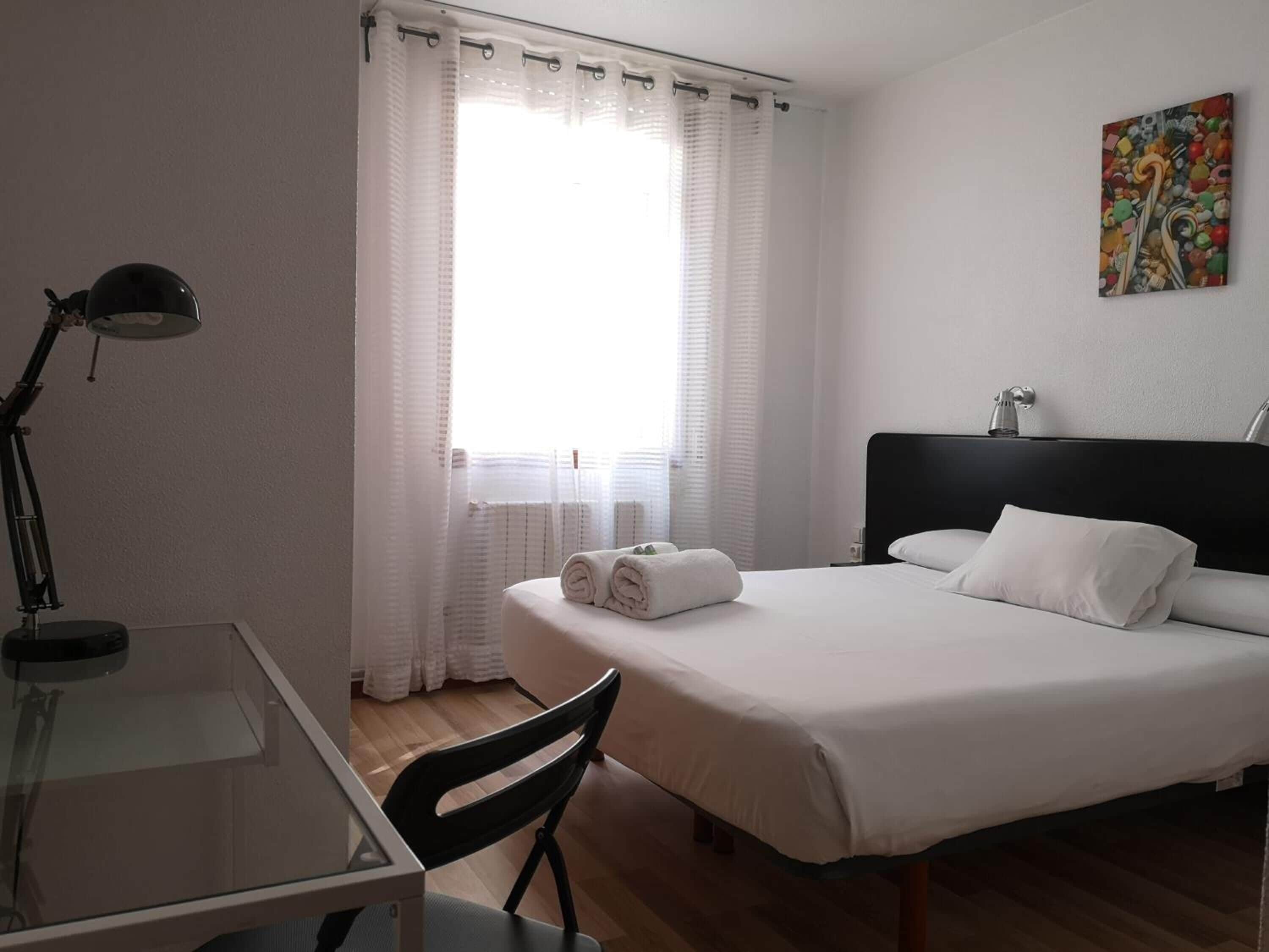 Desk, laptop workspace, blackout curtains, iron/ironing board