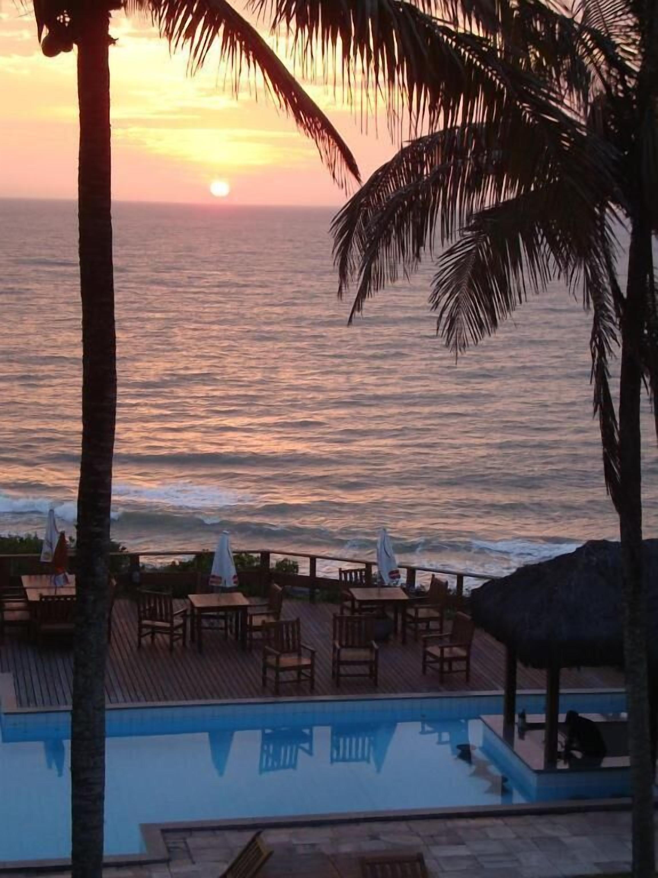 outdoor pool, open 8:00 am to 10:00 pm, pool umbrellas, pool loungers