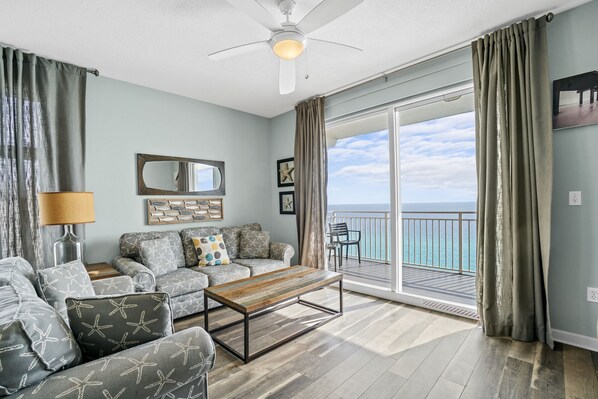 Condo, 3 Bedrooms, Sea View (1401) | Living area | TV, DVD player - Sterling Reef Resort by Panhandle Getaways (Panama City Beach)