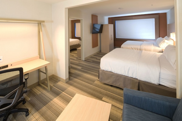 A hotel room with a desk, two beds, a TV, and a large window. - Holiday Inn Express & Suites La Porte by IHG (La Porte)