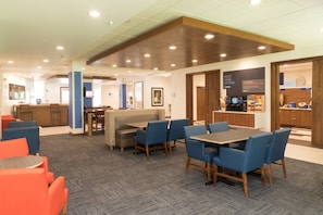 A modern hotel lobby with seating areas, a coffee station, and a reception desk. - Holiday Inn Express & Suites La Porte by IHG (La Porte)