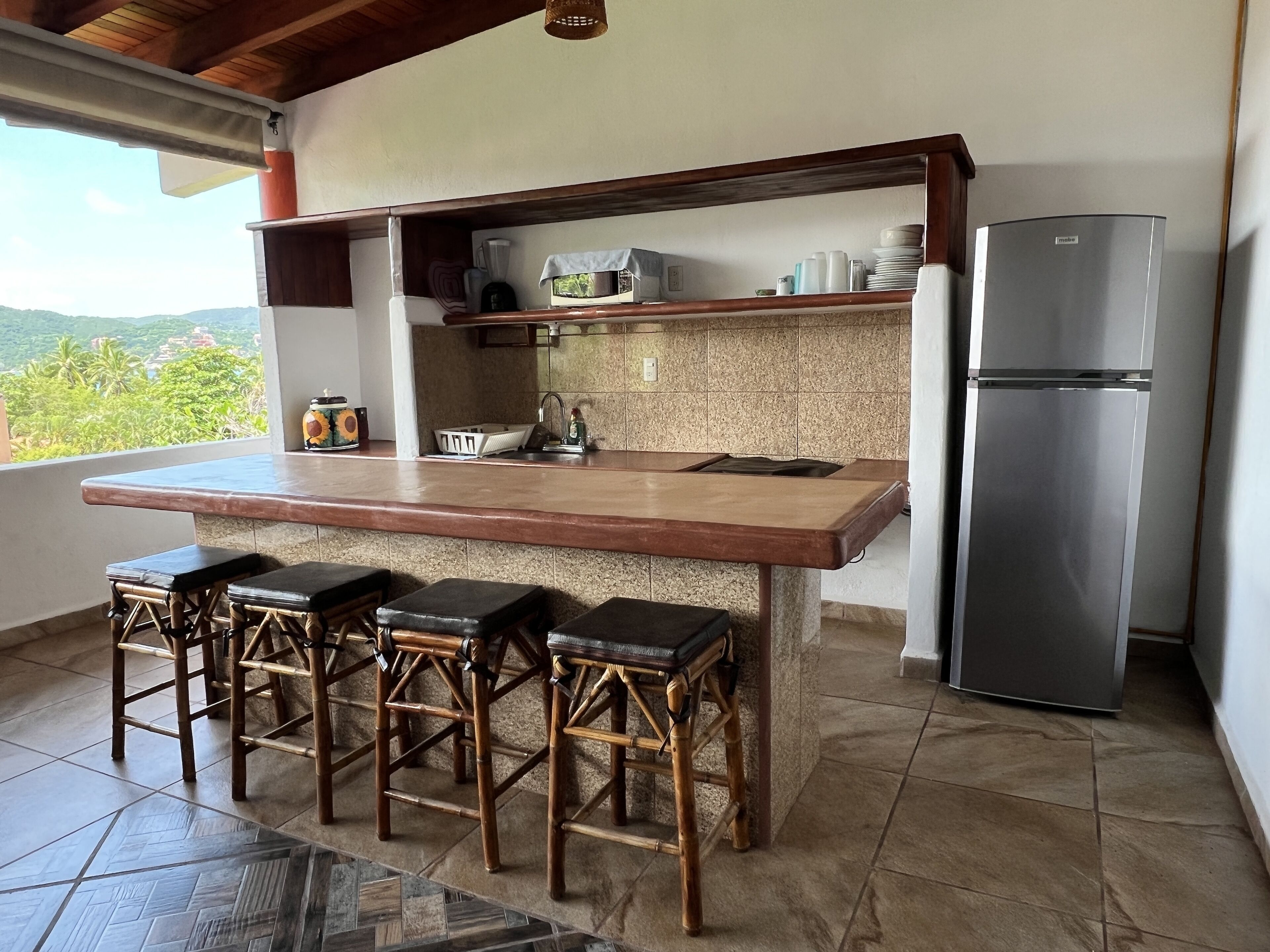 Deluxe Villa, Kitchenette | Private kitchen | Fridge, microwave, stovetop, coffee/tea maker