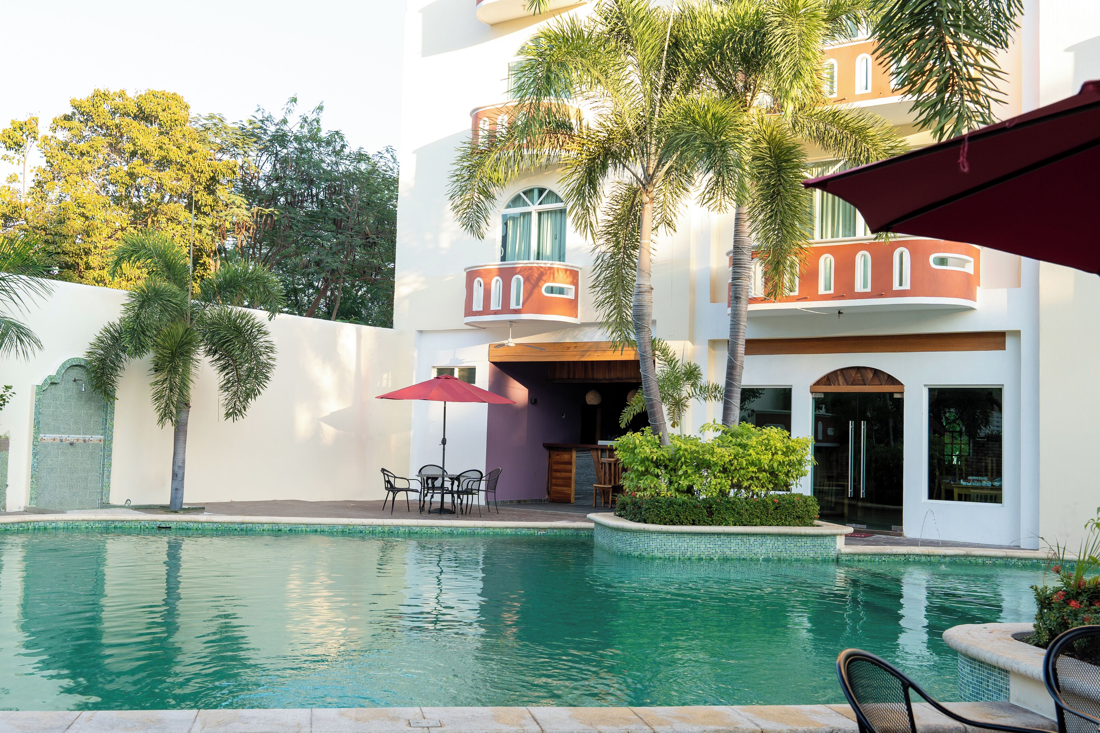 outdoor pool, open 9:00 am to 9:00 pm, pool umbrellas, pool loungers