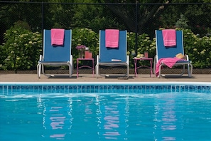 Seasonal outdoor pool, pool loungers