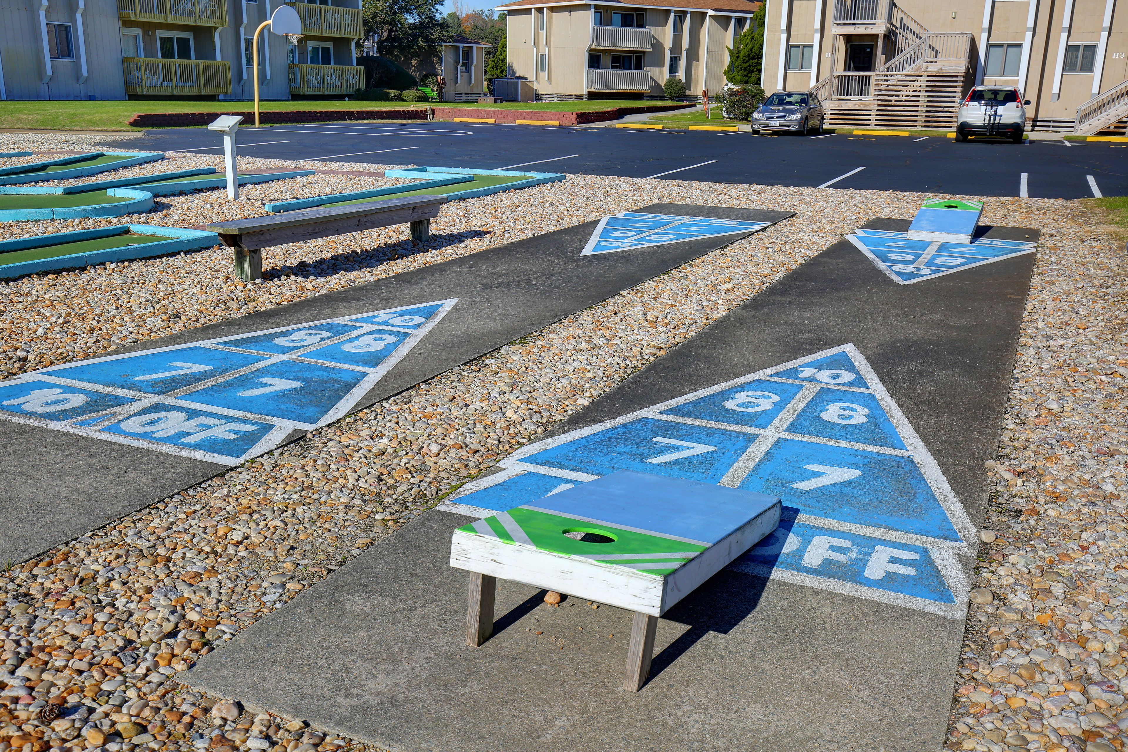A parking area with numbered parking spaces and a small table.