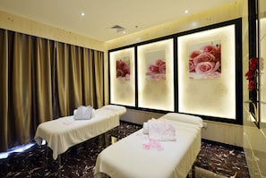 A room with two beds, each with a white bedspread and pillows, and a large window with floral wallpaper. - Xiamen Discovery Hotel (Xiamen)